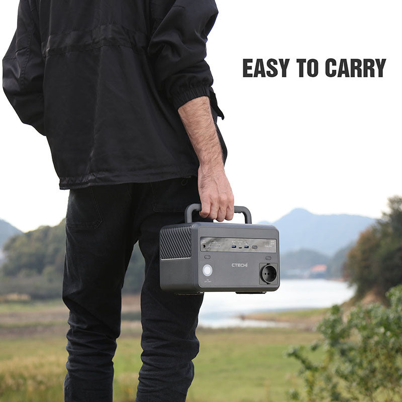 CTECHI Power Station 220V being carried outdoors, showcasing its portability for versatile charging solutions.